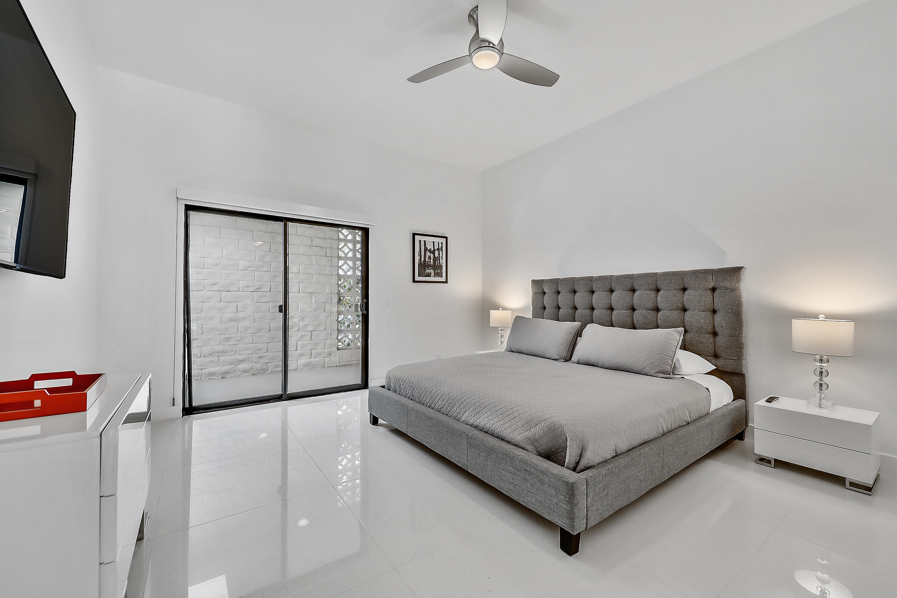 45765 Hopi Road Indian Wells, CA 92210 - Photo 23 of 39 a bedroom with a large bed and a night stand