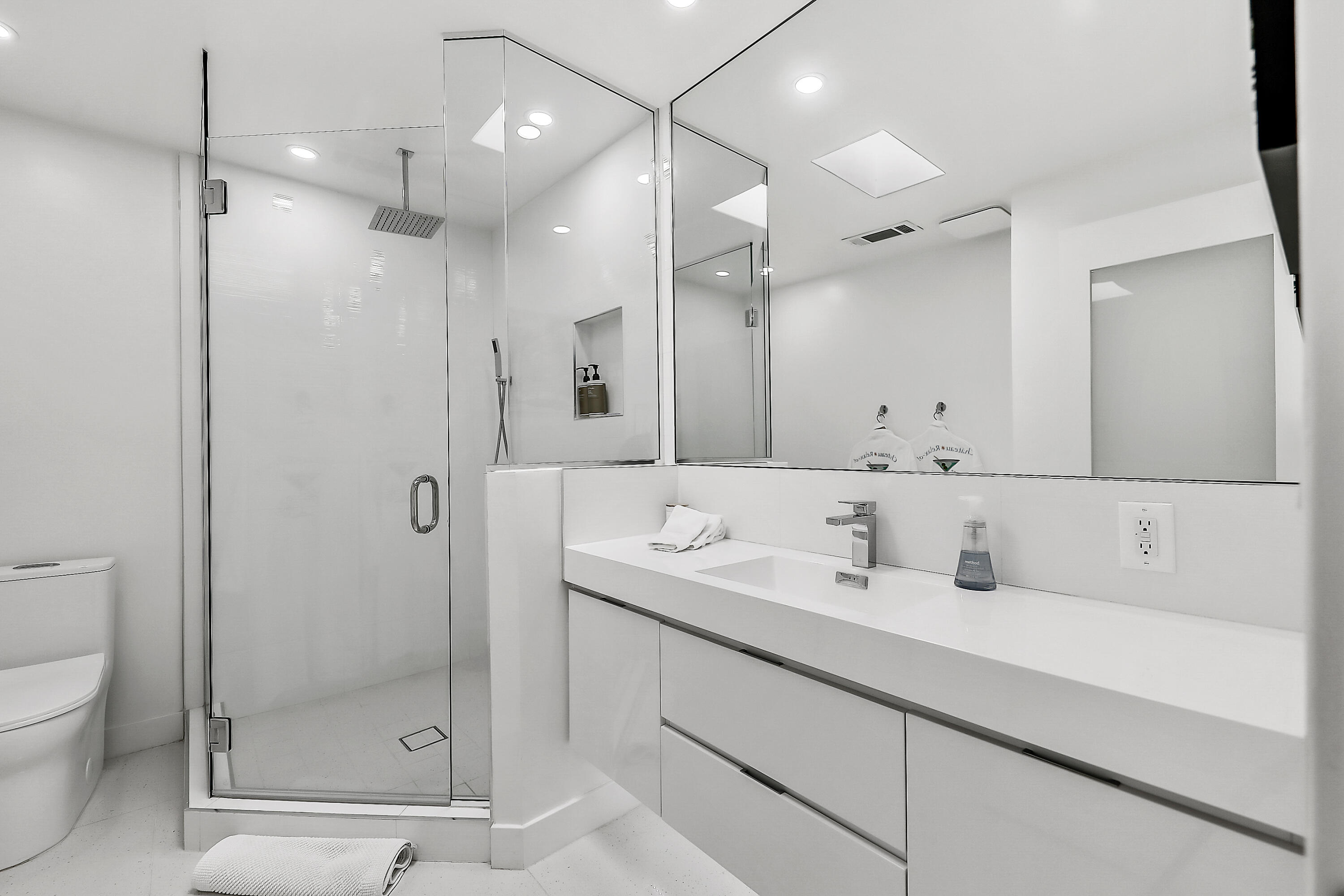 45765 Hopi Road Indian Wells, CA 92210 - Photo 28 of 39 a bathroom with a shower sink vanity and mirror