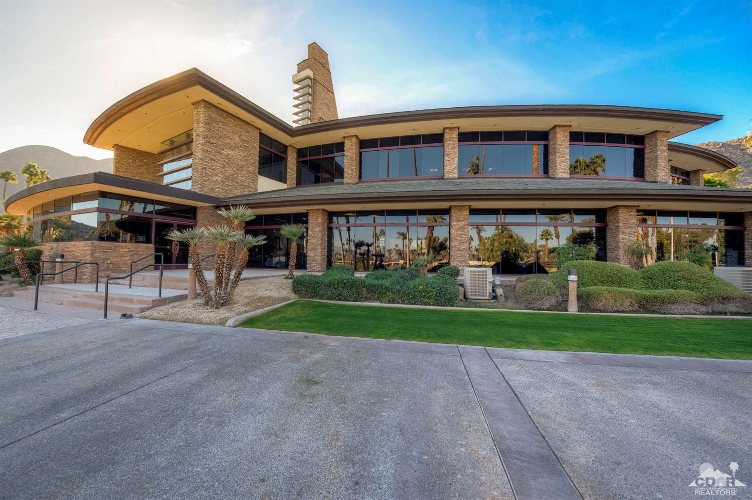 45765 Hopi Road Indian Wells, CA 92210 - Photo 38 of 39 a front view of a house with a yard and potted plants