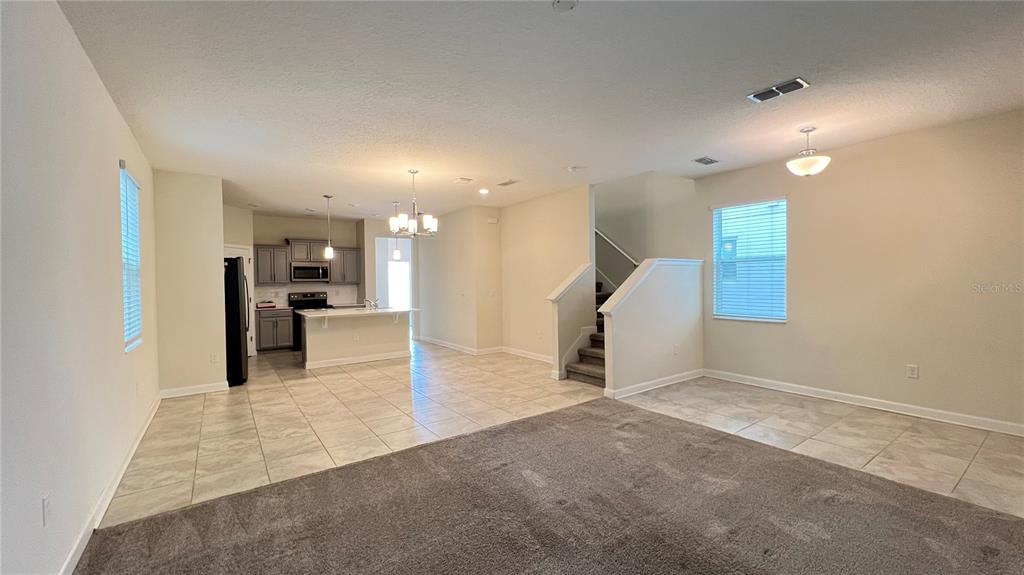 15216 Chapter Way Winter Garden, FL 34787 - Photo 18 of 53 a view of a hallway with a dining table chairs