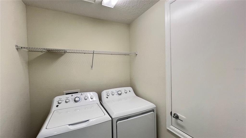 15216 Chapter Way Winter Garden, FL 34787 - Photo 47 of 53 a utility room with dryer and washer