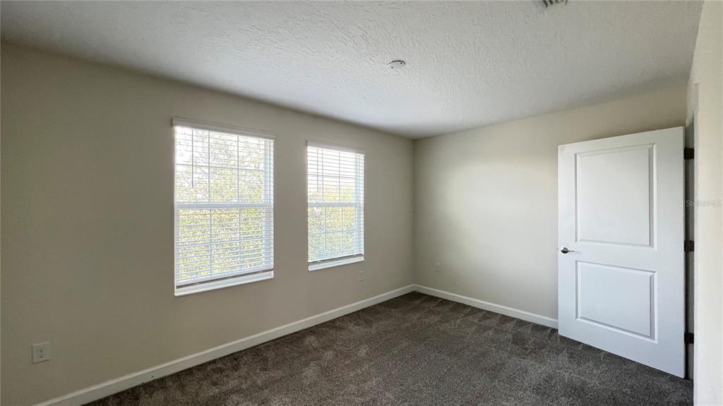15216 Chapter Way Winter Garden, FL 34787 - Photo 49 of 53 an empty room with windows