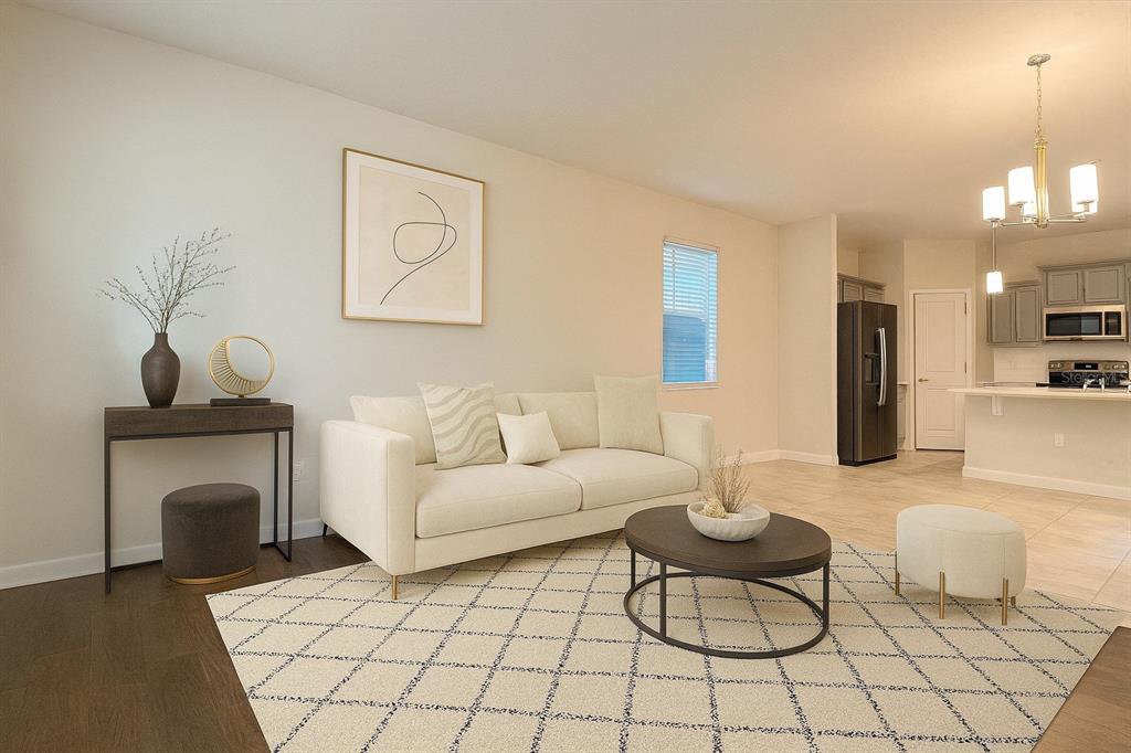 15216 Chapter Way Winter Garden, FL 34787 - Photo 9 of 53 a living room with furniture and a fireplace