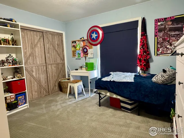 a bedroom with bed and window