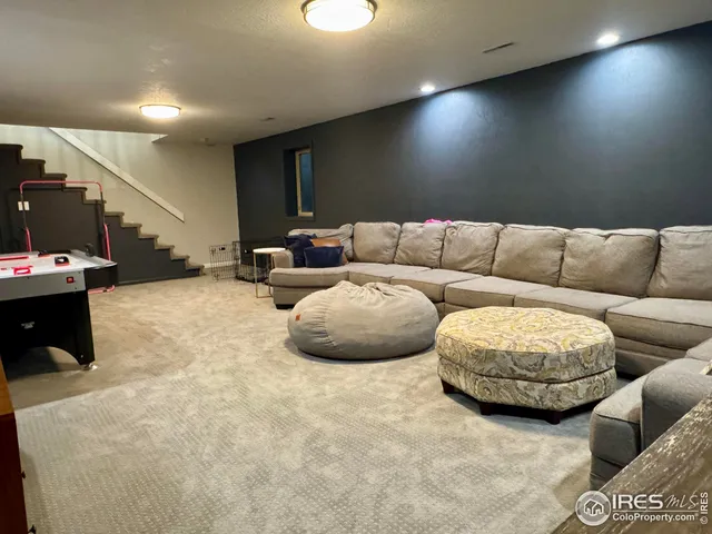 a view of a house with a yard and a large tree
