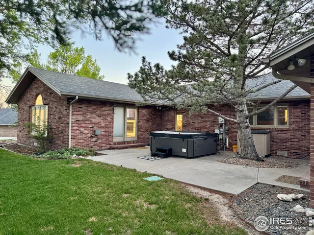 a garden with trees in the background