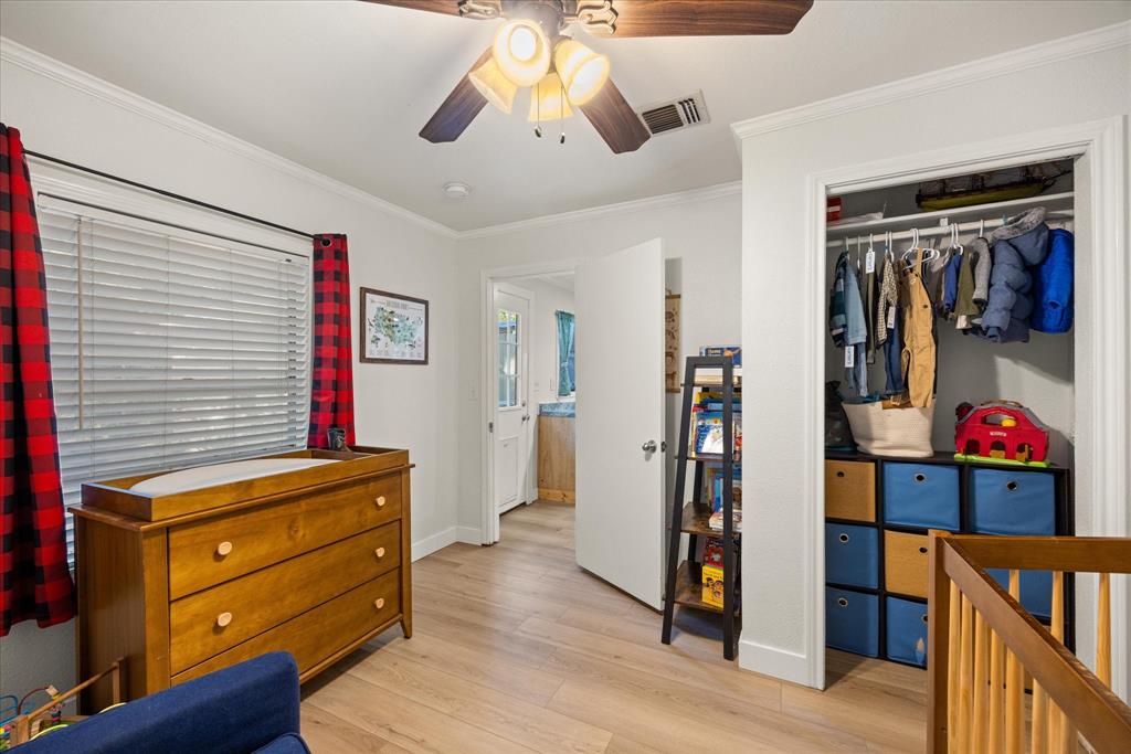 310 West 6th Street Tolar, TX 76476 - Photo 13 of 27 a view of a hallway with closet and wooden floor