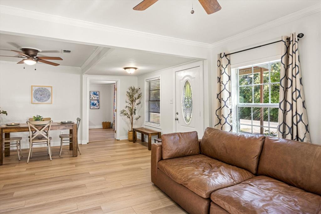310 West 6th Street Tolar, TX 76476 - Photo 27 of 27 a living room with furniture and wooden floor