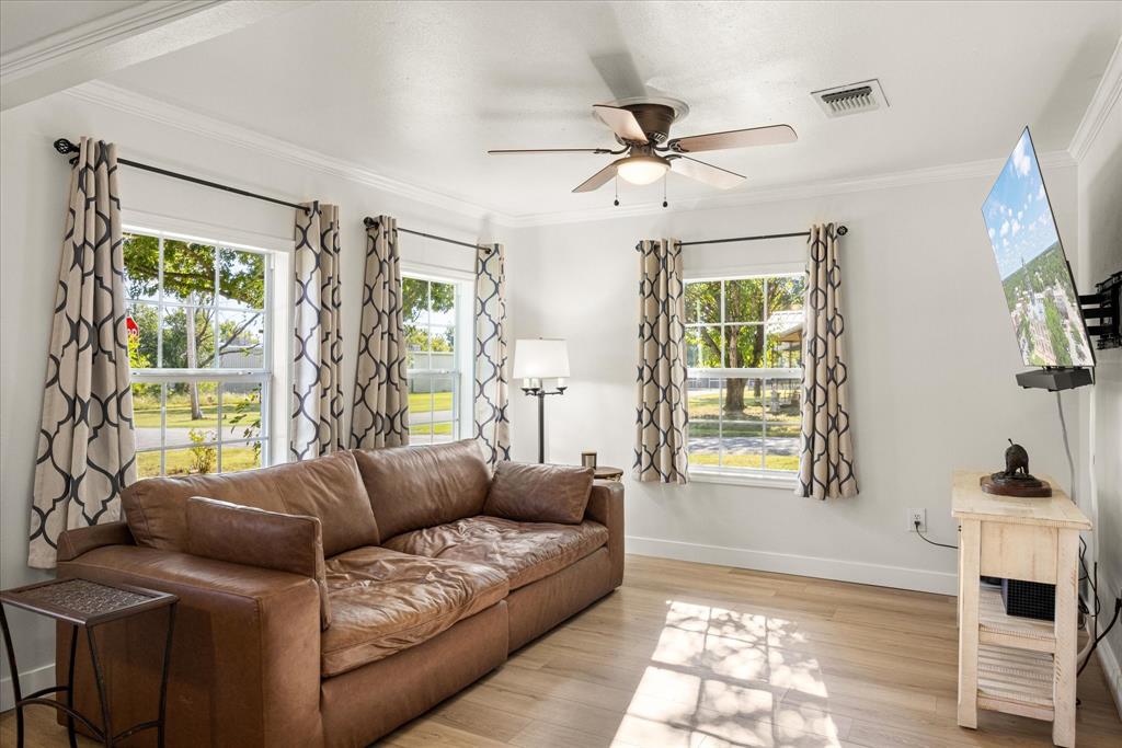 310 West 6th Street Tolar, TX 76476 - Photo 2 of 27 a living room with furniture and a window