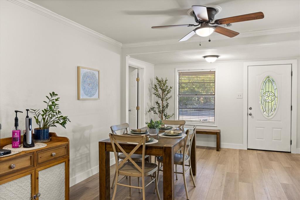 310 West 6th Street Tolar, TX 76476 - Photo 3 of 27 a view of a dining room with furniture window and wooden floor