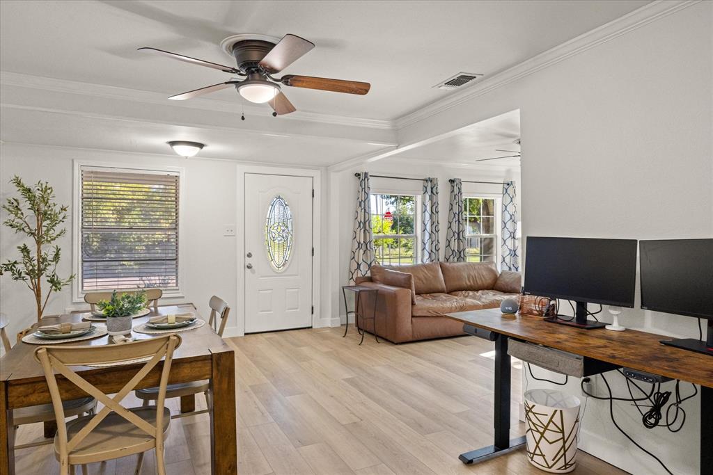 310 West 6th Street Tolar, TX 76476 - Photo 4 of 27 a living room with furniture and a wooden floor