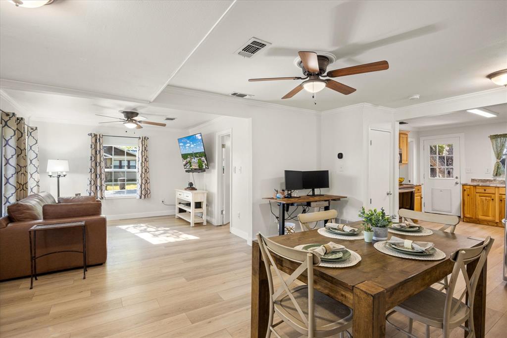310 West 6th Street Tolar, TX 76476 - Photo 7 of 27 a view of a dining room with furniture and wooden floor