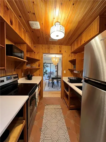 a kitchen with stainless steel appliances a stove and a refrigerator