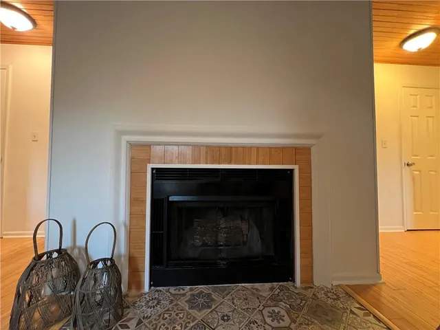 a room with a fireplace and a table