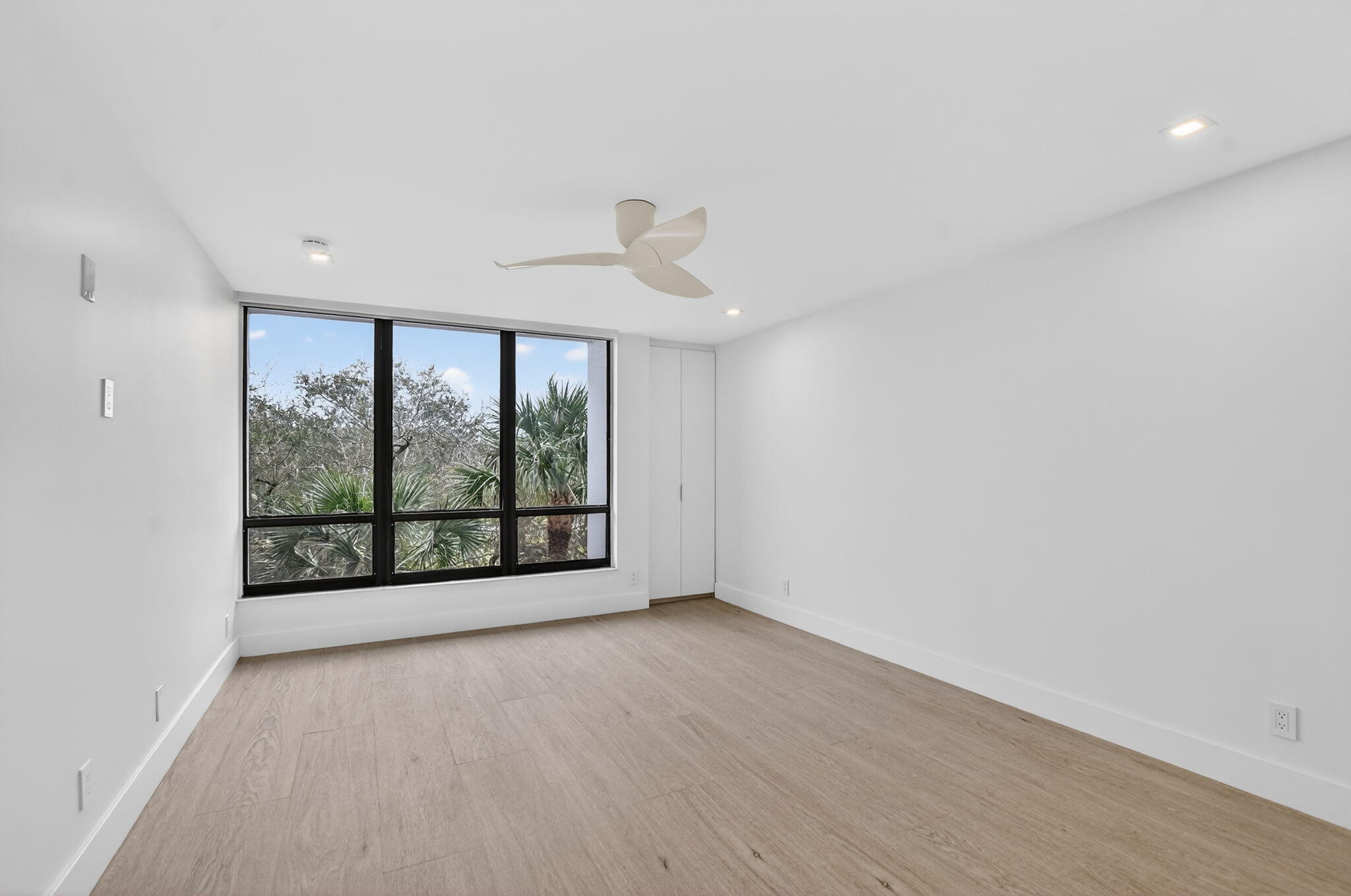 7835 Lakeside Boulevard, Unit 946 Boca Raton, FL 33434 - Photo 12 of 20 wooden floor in an empty room with a window