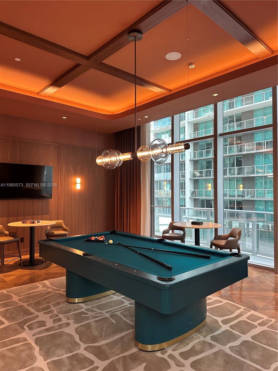 77 Southeast 5th Street, Unit 1514 Miami, FL 33131 - Photo 11 of 16 a room with pool table and windows