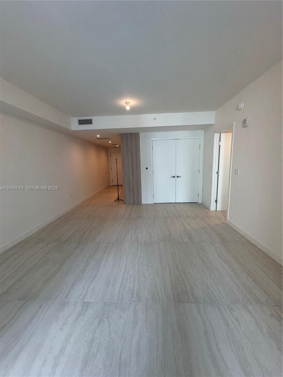 77 Southeast 5th Street, Unit 1514 Miami, FL 33131 - Photo 6 of 16 a view of an empty room