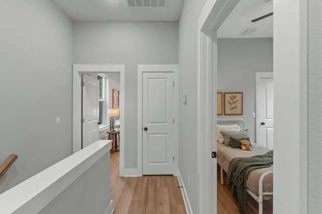 a view of a bedroom from a hallway