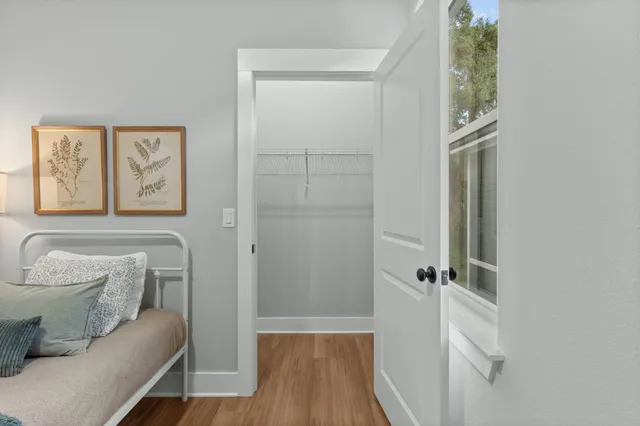 a hallway with a couch and a window