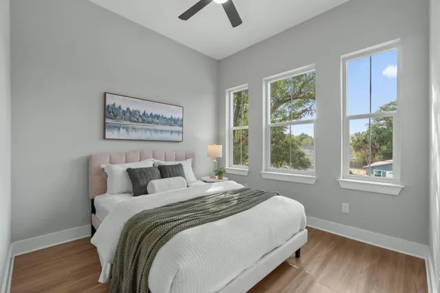 a bedroom with bed and window