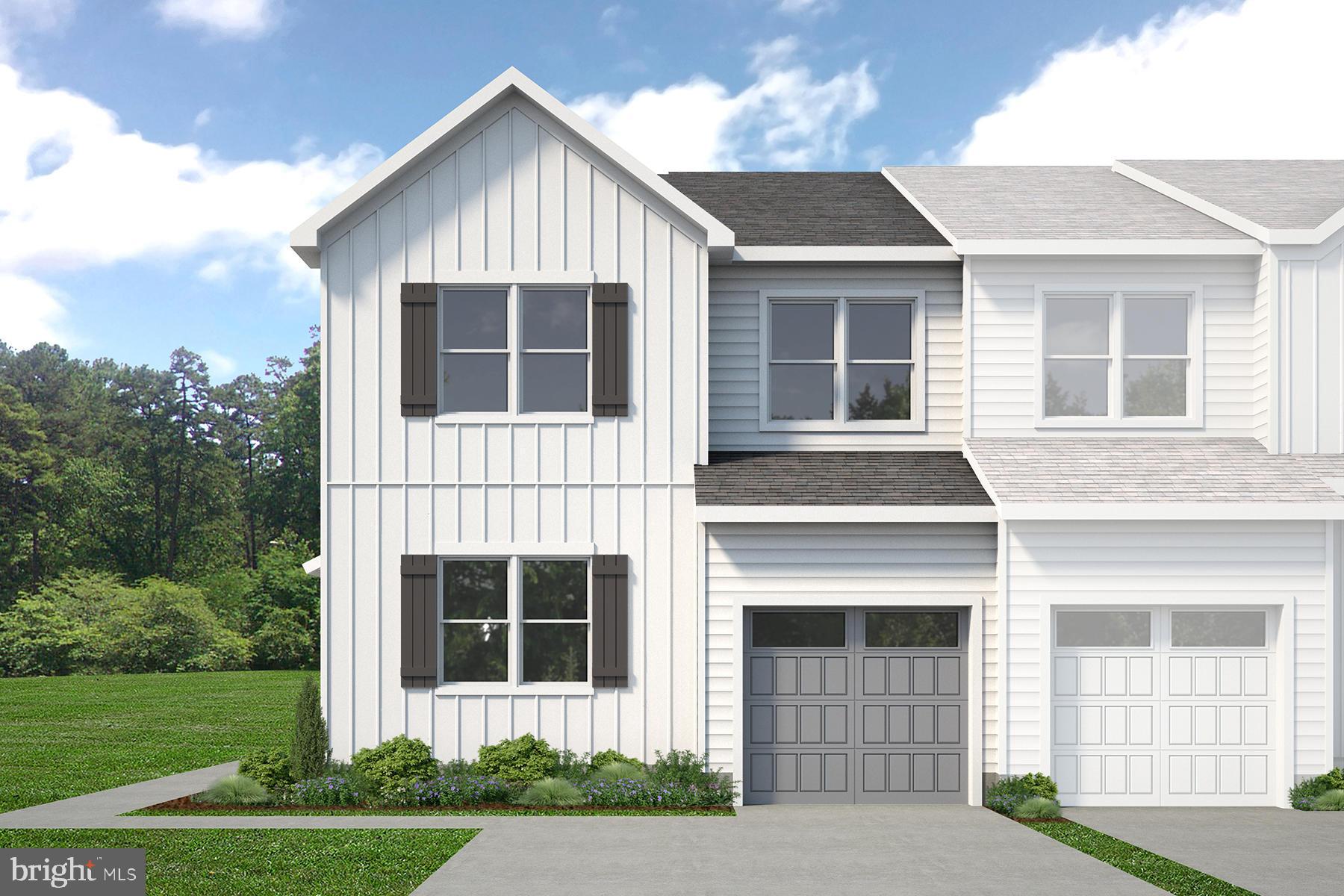 99 Sequoia Drive Berlin, NJ 08009 - Photo 1 of 2 a front view of a house with a yard and garage