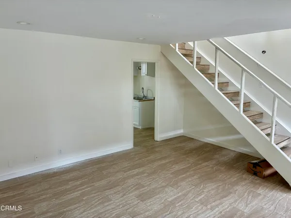 a view of entryway with wooden floor