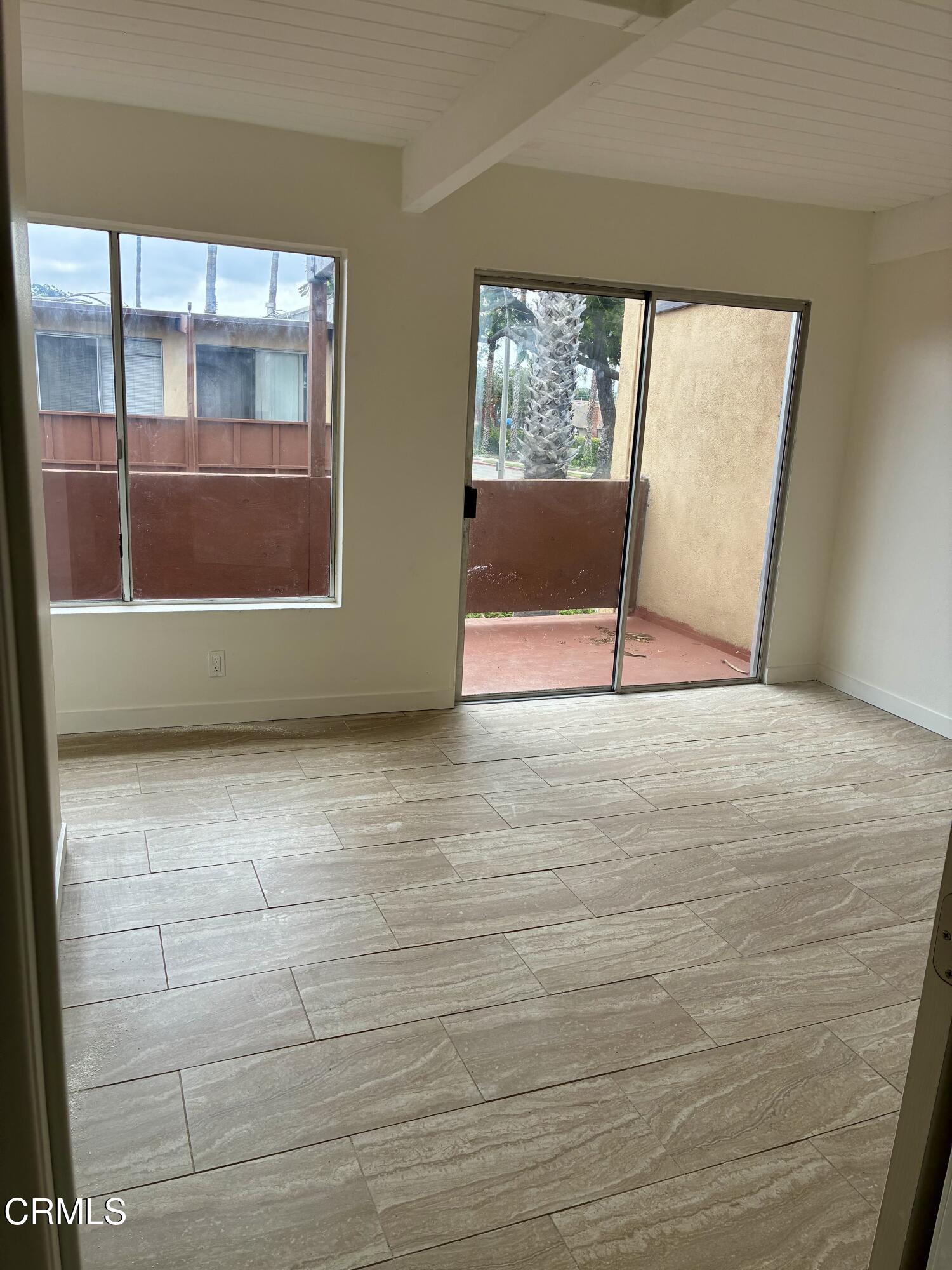 505 West Channel Islands Boulevard, Unit A Oxnard, CA 93033 - Photo 7 of 10 a view of an empty room with a window