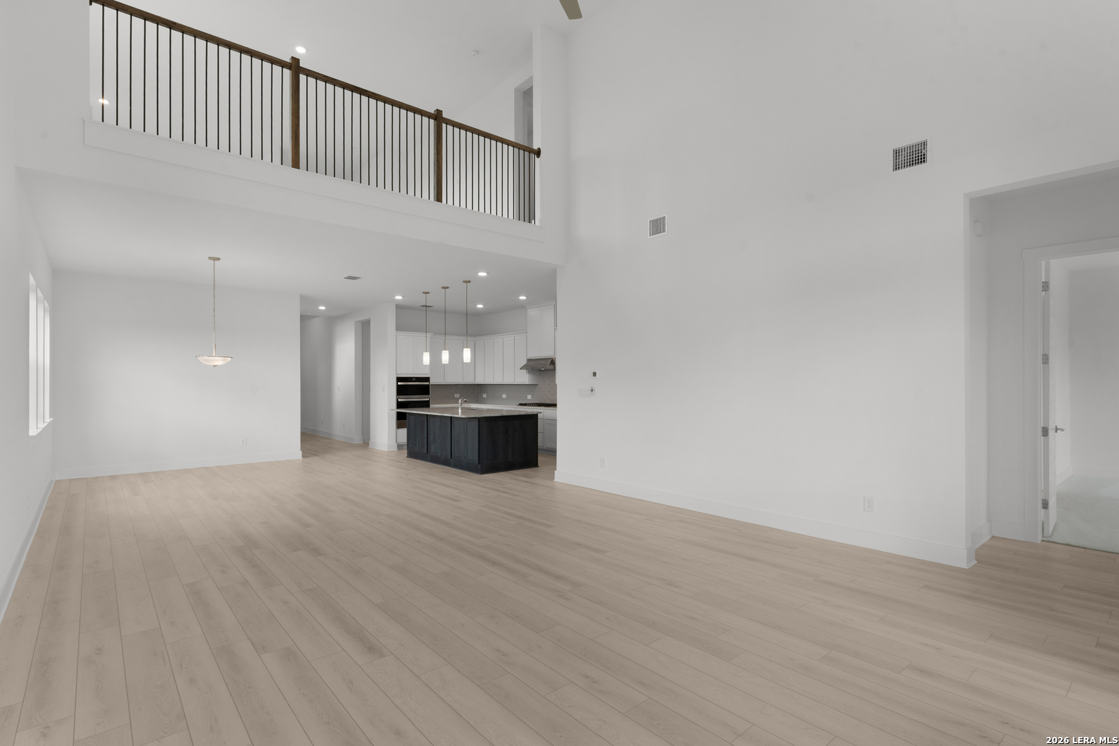 940 Nolte Bend Seguin, TX 78155 - Photo 6 of 19 a view of an empty room with a kitchen
