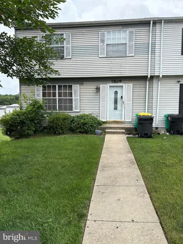 a front view of house with yard