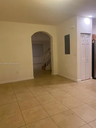 a kitchen with a sink a microwave a stove and refrigerator