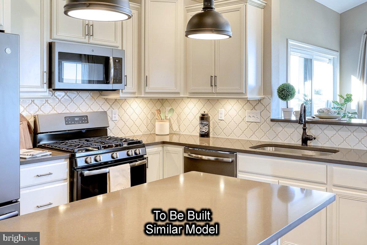150 Old Tulpehocken Road Birdsboro, PA 19508 - Photo 8 of 24 a kitchen with granite countertop a stove a sink and a granite counter tops