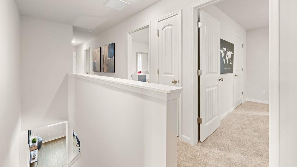 3869 Donetta Drive Atlanta, GA 30349 - Photo 25 of 49 a view of a hallway with windows and chandelier