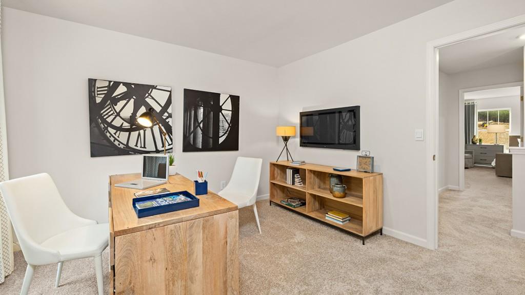3869 Donetta Drive Atlanta, GA 30349 - Photo 34 of 49 a living room with furniture and a flat screen tv