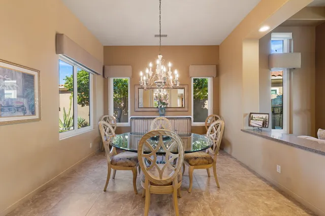 a livingroom with workspace and a window