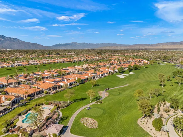 a view of a house with a chairs in patio