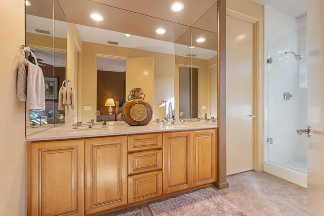 a view of a patio with table and chairs and potted plants