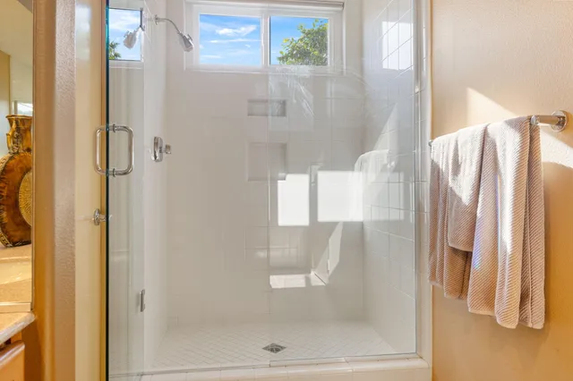 a view of a patio with dining table and chairs with plants