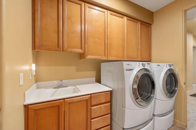 a view of a patio with a table and chairs