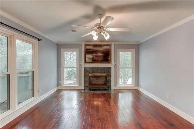 wooden floor in an empty room with a fireplace