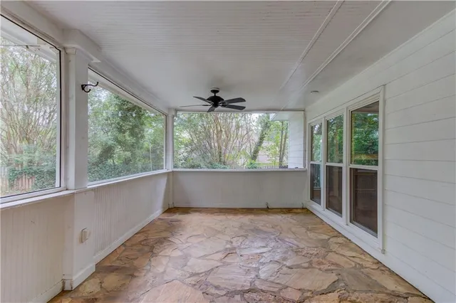 a view of an empty room with a window