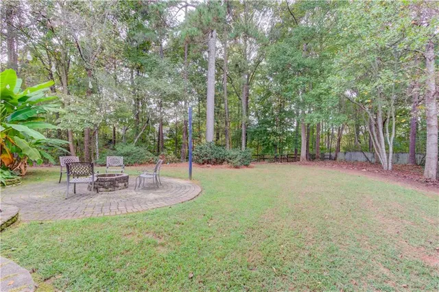 a view of a park with large trees
