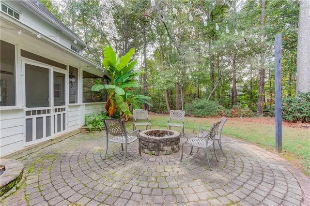 a view of a patio with a table and chairs