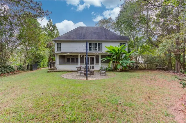 a house view with swimming pool and garden space