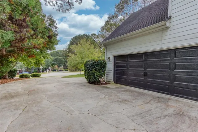 a view of the house with a yard