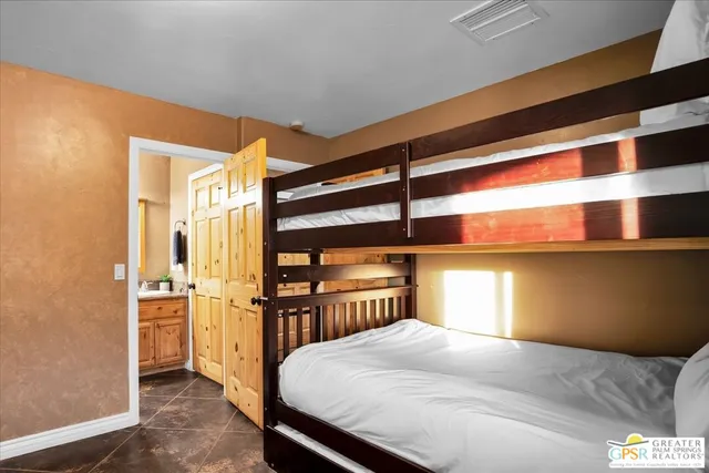 a bedroom with a bed and a cabinets