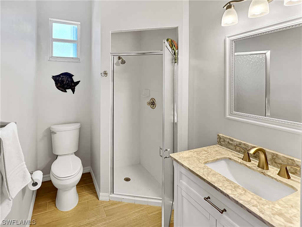 20631 Rivers Ford Estero, FL 33928 - Photo 13 of 18 a bathroom with a granite countertop sink toilet and shower