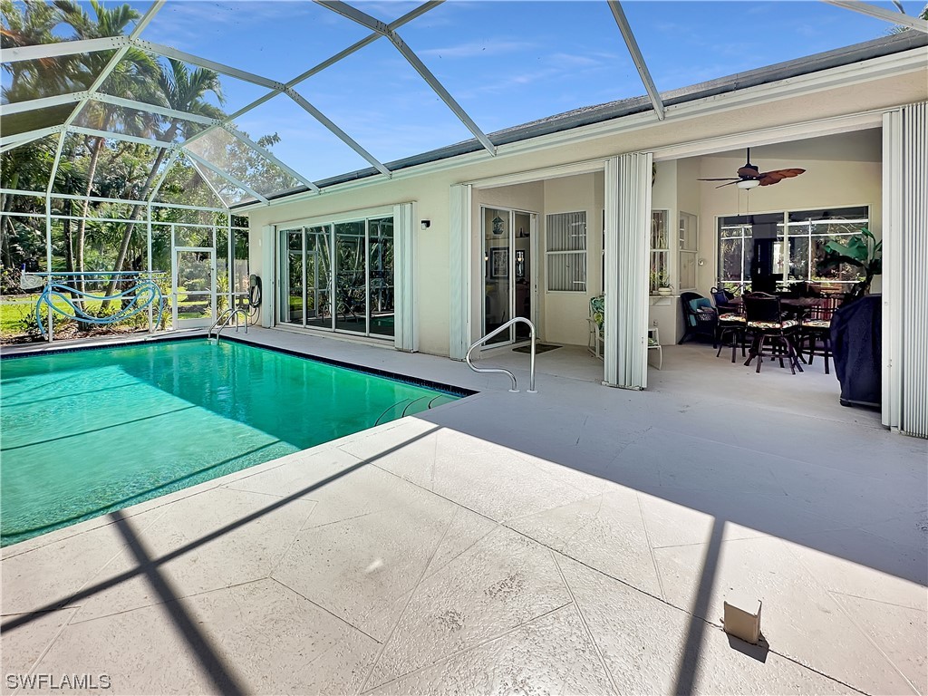 20631 Rivers Ford Estero, FL 33928 - Photo 15 of 18 a swimming pool with outdoor seating and yard