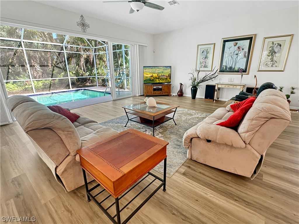 20631 Rivers Ford Estero, FL 33928 - Photo 4 of 18 a living room with furniture and a flat screen tv