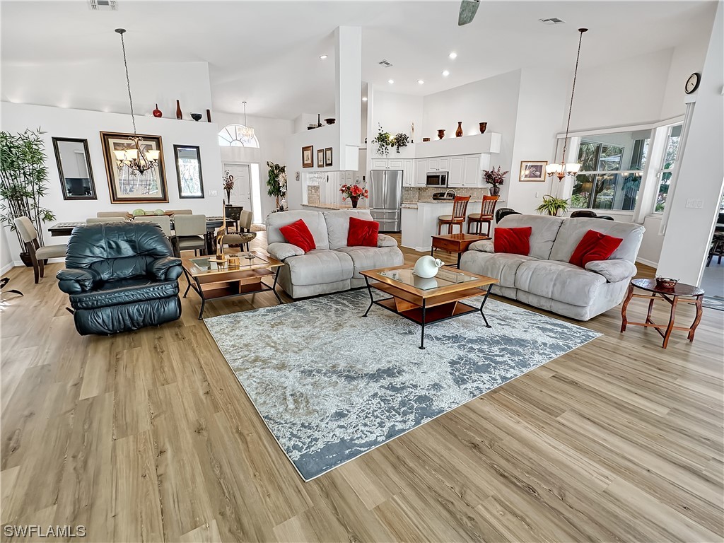 20631 Rivers Ford Estero, FL 33928 - Photo 5 of 18 a living room with furniture and kitchen view