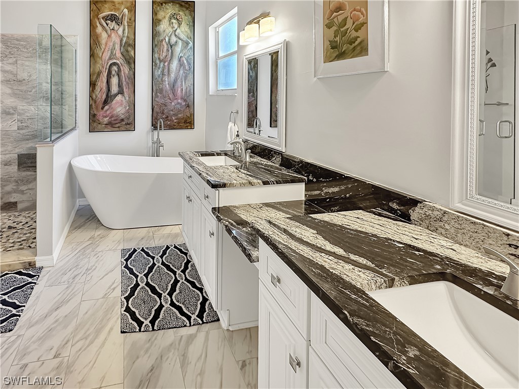 20631 Rivers Ford Estero, FL 33928 - Photo 10 of 18 a bathroom with a granite countertop sink and a mirror